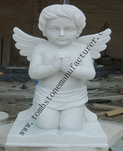 praying angel kneeling on Bible